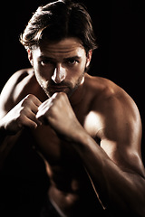 Image showing Portrait, body of man and fist of boxer in studio isolated on black background. Serious face, boxing or muscle of topless athlete ready to fight, exercise or training, combat sport or fitness workout