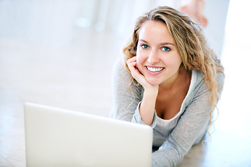 Image showing Laptop, portrait and happy woman on floor in home, email and internet for remote work. Computer, smile and girl, person or freelancer on social media, website or online communication on tech to relax