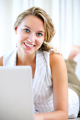 Image showing Portrait, laptop and smile of woman in home on floor for networking, typing email and relax. Computer, happy face and girl on internet, search and communication on social media, website and online