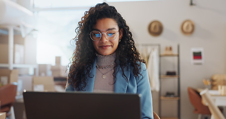 Image showing Woman, fashion designer and laptop in small business management, logistics or research at boutique. Female person or entrepreneur working on computer for inventory or storage check at retail store