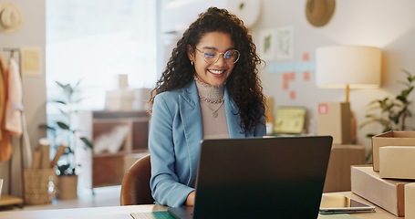 Image showing Happy woman, fashion designer and laptop in small business management or logistics at boutique store. Female person or entrepreneur working on computer for inventory or storage check at retail shop