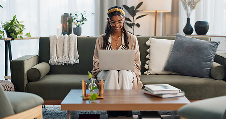 Image showing Laptop, freelance and happy woman on sofa for social media, research or reading at home. Tech, remote work or female entrepreneur online in living room with email, learning or upskill training course