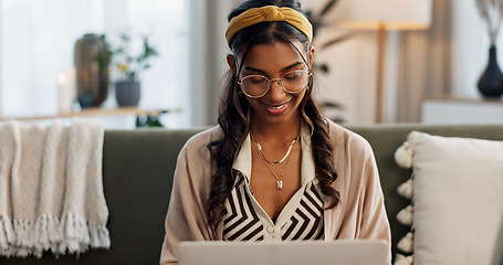 Image showing Laptop, smile and a woman designer on a sofa in the living room of her home for remote work while planning. Computer, email and a happy young freelance employee working online for startup business