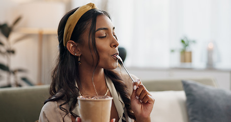 Image showing Woman, eating ice cream and sofa in house, thinking or idea for dessert, sweets or relax in living room. Girl, gelato or frozen yogurt for snack, lounge couch and home with memory, choice or decision