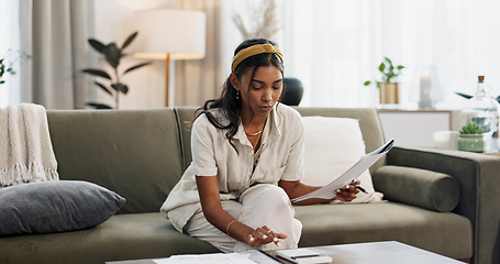 Image showing Woman, calculator and budget on sofa of home finance, taxes documents and income or salary management. Young person with paperwork, invoice or loan, inflation and bills for rent cost in living room