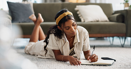 Image showing Woman, writing and home with notes in living room for planning a schedule and checklist. Book, learning and thinking of a female freelancer doing remote work with ideas in a journal with a list