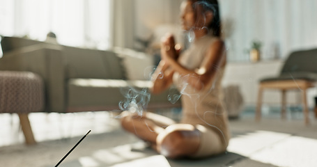 Image showing Woman, yoga and incense on floor, meditation or peace for chakra balance, relax and breathing in home living room. Girl, meditate or spiritual with smoke, workout and wellness for zen mindfulness