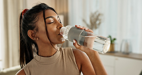 Image showing Drinking water, yoga or Indian woman in home with health, fitness or wellness for natural hydration. Thirsty female person, tired or healthy girl with liquid bottle after pilates to detox or relax