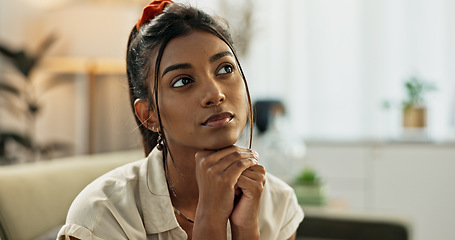 Image showing Thinking, reflection and young woman on a sofa relaxing with an idea or memory in living room. Anxious, mental health and nervous Indian female person with decision in the lounge of modern apartment.