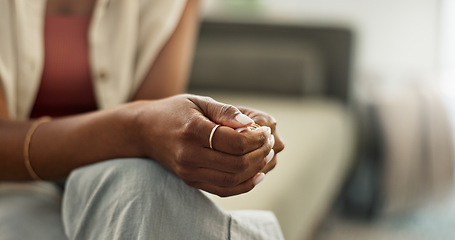 Image showing Anxiety, hands and closeup of woman on a sofa with fear, worry or mental health crisis at home. Stress, zoom and female person in living room with conflict trauma, ptsd or disaster, mistake or abuse