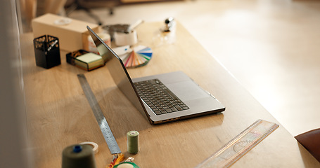 Image showing Laptop, ruler and design with color palette on desk for project, fashion or sample test in workshop. Computer, tools and thread for fabric, material or textile for art, clothes or production on table