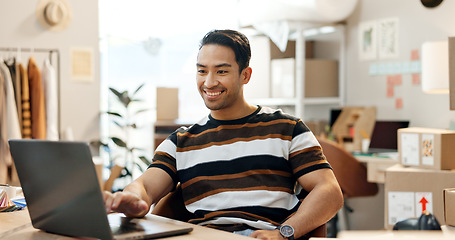 Image showing Designer man, laptop and boxes with smile, scroll and e commerce with stock, clothes and check sales report. Entrepreneur, small business owner and computer with fashion, inventory and distribution