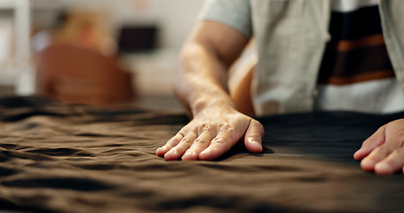 Image showing Designer hands, fabric and manufacturing clothes at desk, factory and fashion industry in workshop. Creative tailor, process and production with textile, cloth and sustainable material in boutique