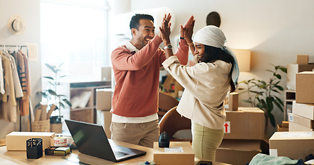 Image showing Man, woman and high five for laptop, logistics industry and success for startup, moving boxes or costs. Business partners, partnership or ecommerce for team, excited or sales for smile, happy or job