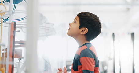 Image showing Thinking, child and in a lab for science, learning and education on research. Smile, idea and a boy, kid or student with a future in innovation, biology or futuristic classroom for studying