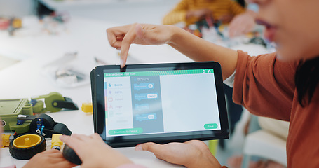 Image showing Kids, coding and learning robotics with tablet, screen and engineering app in classroom. Child, hands and show elearning technology with online education game to remote control robot or device