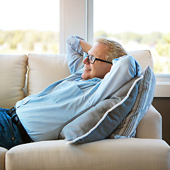 Image showing Thinking, sofa or happy mature man in house living room to relax with nostalgia or freedom on resting break. Glasses, remember or senior male person with smile, joy or memory in retirement on couch