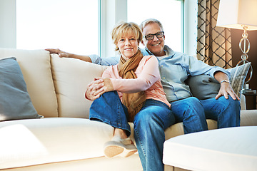 Image showing Relax, retirement and portrait of couple on sofa for bonding, healthy relationship and marriage. Happy, home and senior man and woman hug on couch for love, commitment and embrace in living room