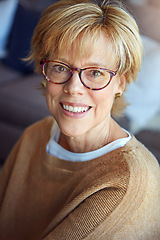 Image showing Mature, relax or portrait of happy woman in glasses in house living room with freedom, pride for resting break. Apartment, face or senior person with smile or wellness in retirement, lounge or home