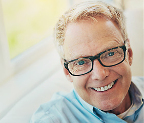 Image showing Portrait, glasses or happy mature man in house living room to relax with care on sofa for resting break. Apartment, face or senior male person with smile or wellness in retirement, lounge or home