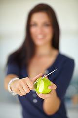 Image showing Hands, knife and woman peeling apple for food, eating organic vegan snack and vitamin c. Closeup, cutting skin on fruit and person slice for healthy diet, natural benefits and wellness or nutrition