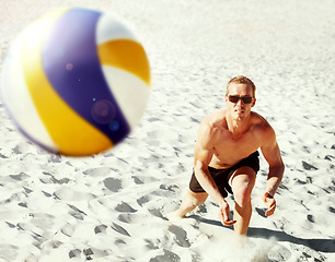 Image showing Beach, volleyball and top view of fitness man at sea with ball, energy or travel freedom. Ocean, sport or top view of male player with handball in nature for cardio, workout or game performance