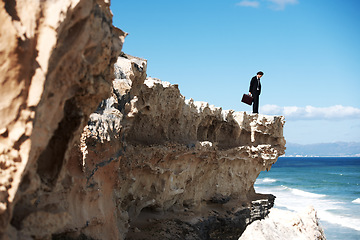 Image showing Thinking, cliff and sad business man with anxiety for job, career opportunity and work in nature. Professional, mockup and corporate worker on edge with challenge, depression and worry for future