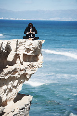 Image showing Business man, relax and meditation on cliff, peace and spiritual wellness by ocean, beach and outdoors. Male person, breathing exercise and yoga for stress management, zen mindfulness in Hawaii