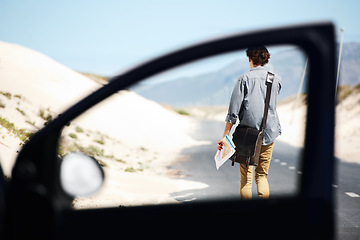 Image showing Lost, man and map for travel in car, journey and driver on a road trip and adventure. Confused, direction and person walking to check location with transport to explore countryside or search guide