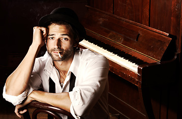 Image showing Portrait, man and musician with a cigarette, piano and entertainment with talent, style and performer. Face, pianist and artist with tobacco, smoking and jazz player with unhealthy habit or creative