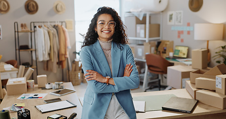 Image showing Portrait, business woman and fashion designer with arms crossed in boutique, clothes store or startup. Confidence, happy tailor and professional, entrepreneur and creative worker in glasses in Brazil