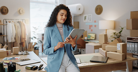 Image showing Business woman, fashion designer and tablet in logistics, research or management at boutique. Female person or entrepreneur working on technology in storage or inventory check or ecommerce app