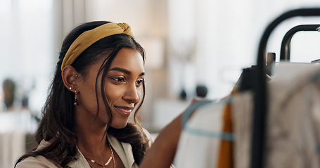 Image showing Shopping, sale and happy woman at a mall for clothes, outfit or thrift store fashion choice. Retail, decision or Indian customer check boutique fabric quality, clothing rack or discount deal search