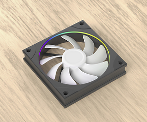 Image showing Computer fan on wooden desk
