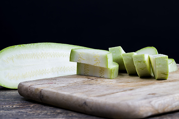 Image showing cut into parts ripe delicious zucchini,