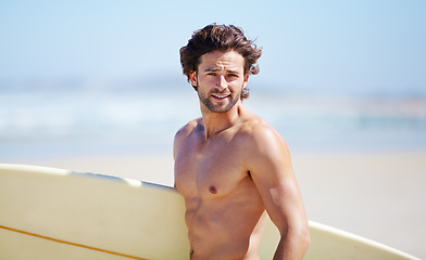 Image showing Beach portrait, surfing and fitness man on sports holiday, vacation or getaway for nature wellness, sea break or hobby. Surfboard, activity and surfer on tropical island paradise, coast or shore