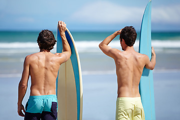 Image showing Beach friends, surfboard and sports people on holiday adventure, travel vacation or ready for hobby, activity or surfing. Nature, ocean sea waves or back of surfer, athlete or partner looking at view