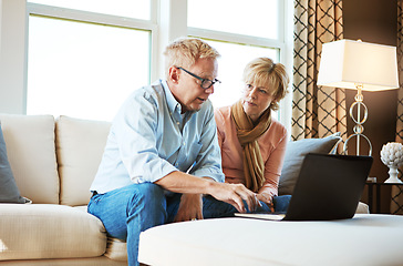 Image showing Laptop, budget discussion or mature couple in home typing for savings or planning an investment together. Finance web, email notification or senior people on pc for mortgage research in living room