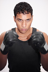 Image showing Portrait, fight and a man or boxer on a white background for a competition, fitness or training for a match. Exercise, cardio and a strong male fighter with gloves for a sport, boxing or workout