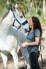 Image showing Woman with horse, animal and equestrian with riding outdoor in countryside and ranch. Sports, recreation and farm with young rider in nature, stable and jockey with mare or pet, training for rodeo