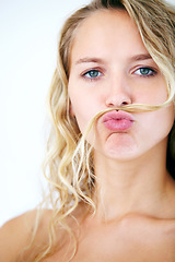 Image showing Woman, portrait and hair mustache for fun mood, scold finger or funny personality. Female person, face and humor kiss on white studio background for confident playful attitude, point or comedy joke