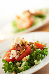 Image showing Plate, closeup and a salad on a table for lunch, nutrition or eating to a a diet. Zoom, health and vegetable, dinner and an arrangement of food for detox, cooking or hungry with a dish for brunch