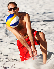 Image showing Beach sand, sports man and strike volley ball in game, competition or outdoor practice challenge, match or contest. Fitness workout, athlete action and player hit volleyball on nature cardio vacation