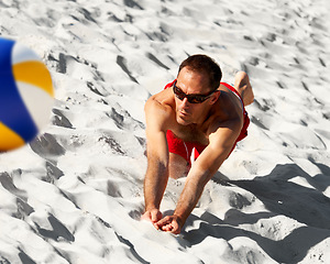 Image showing Beach, air volley ball and sports man running, jump and action in game, competition or outdoor practice challenge. Athlete skill, volleyball player or fitness person training on tropical island sand