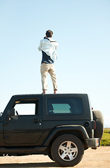 Image showing Man, photographer and camera on roof of car, summer road trip or vacation outdoor on mockup space. Back view, person on suv rooftop and photography of driver on transport, nature adventure or travel