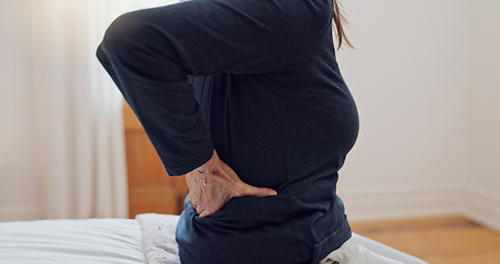 Image showing Senior woman, back pain and home bedroom with muscle problem and arthritis in retirement. Elderly patient, osteoporosis and injury on a bed with hands holding for support of inflammation with crisis