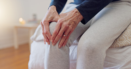 Image showing Hands, pain and closeup of senior woman in bedroom with injury, hurt or accident at nursing home. Sick, illness and zoom of elderly female person in retirement holding leg with sprain muscle at house