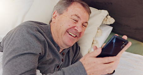 Image showing Happy, senior man and reading with phone in bed or streaming funny, comedy or meme on social media. Elderly person, smile or relax with cellphone at night in bedroom with communication or online chat