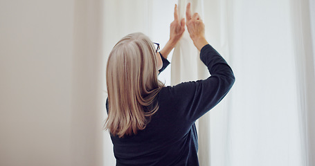 Image showing Senior woman in home, opening curtains and getting ready for the day with sun, light and fresh air. Morning routine, retirement and elderly person at window in apartment, housework and chores in room