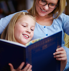 Image showing Reading, books and mother with girl in library with smile, help learning and relax with study knowledge. Storytelling, happy mom and child in bookstore together with story, fantasy and education.